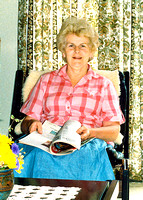 Mum sitting in her lounge chair about 1990